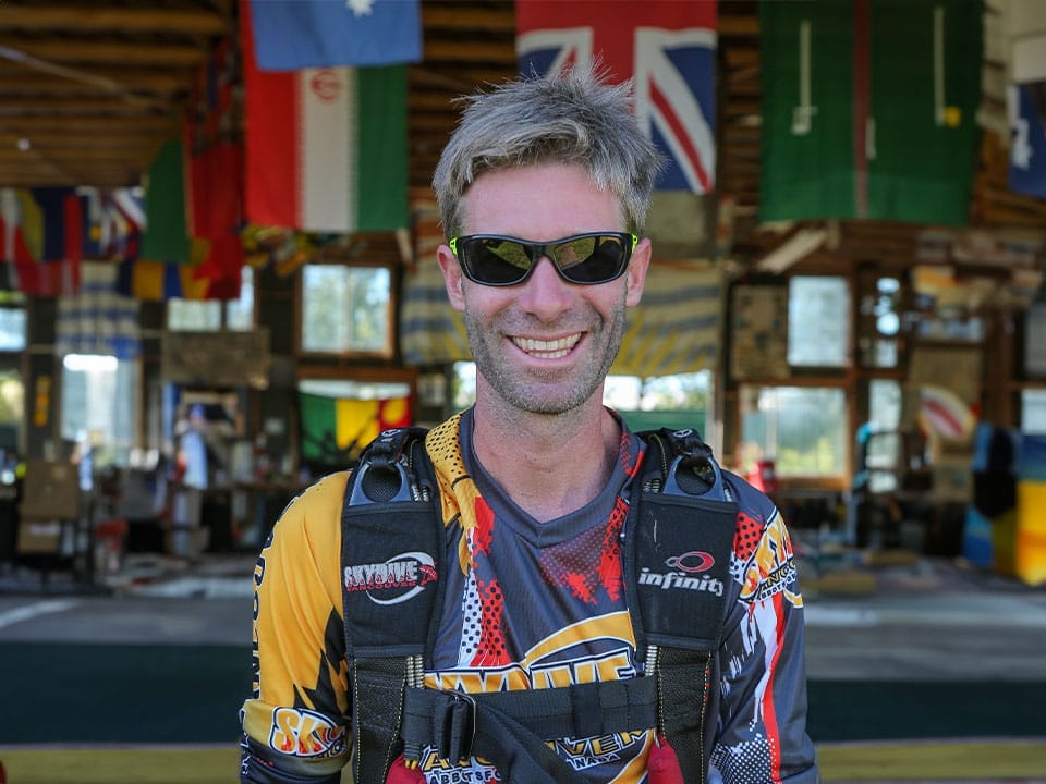 Jess Harper in skydiving gear and sunglasses