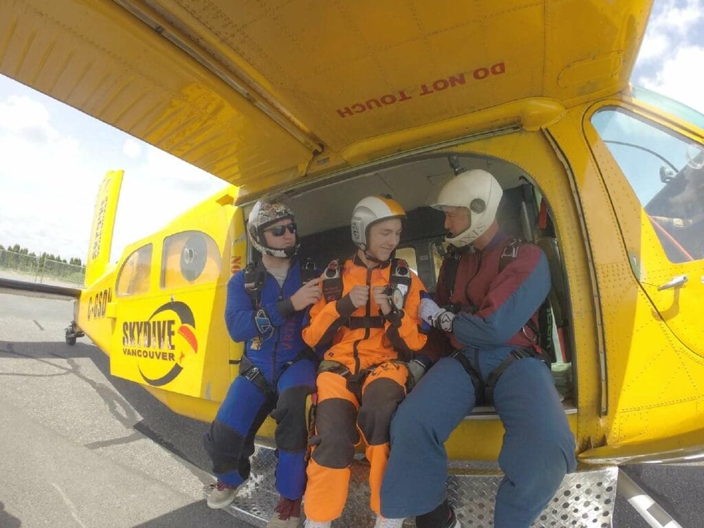 A group of people in a yellow plane
